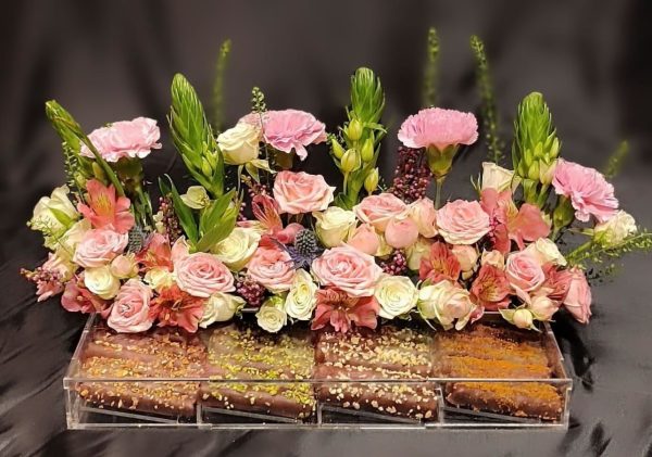 Chocolate sticks and mixed flowers